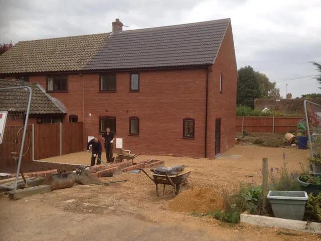 Builders doing a garden renovation for a house