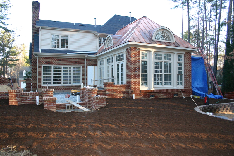 Newly renovated house with a leveled garden ready for paving slabs